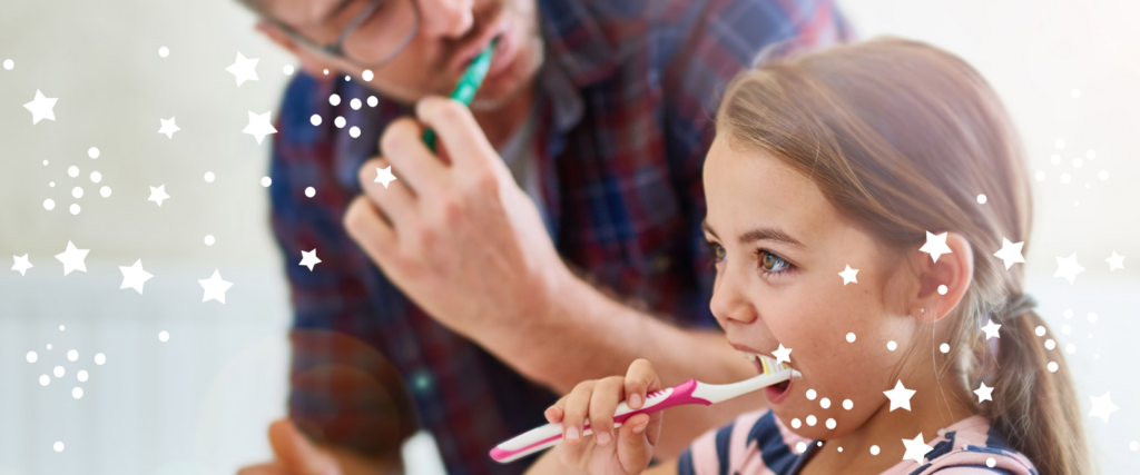 A young girl brushing her teeth